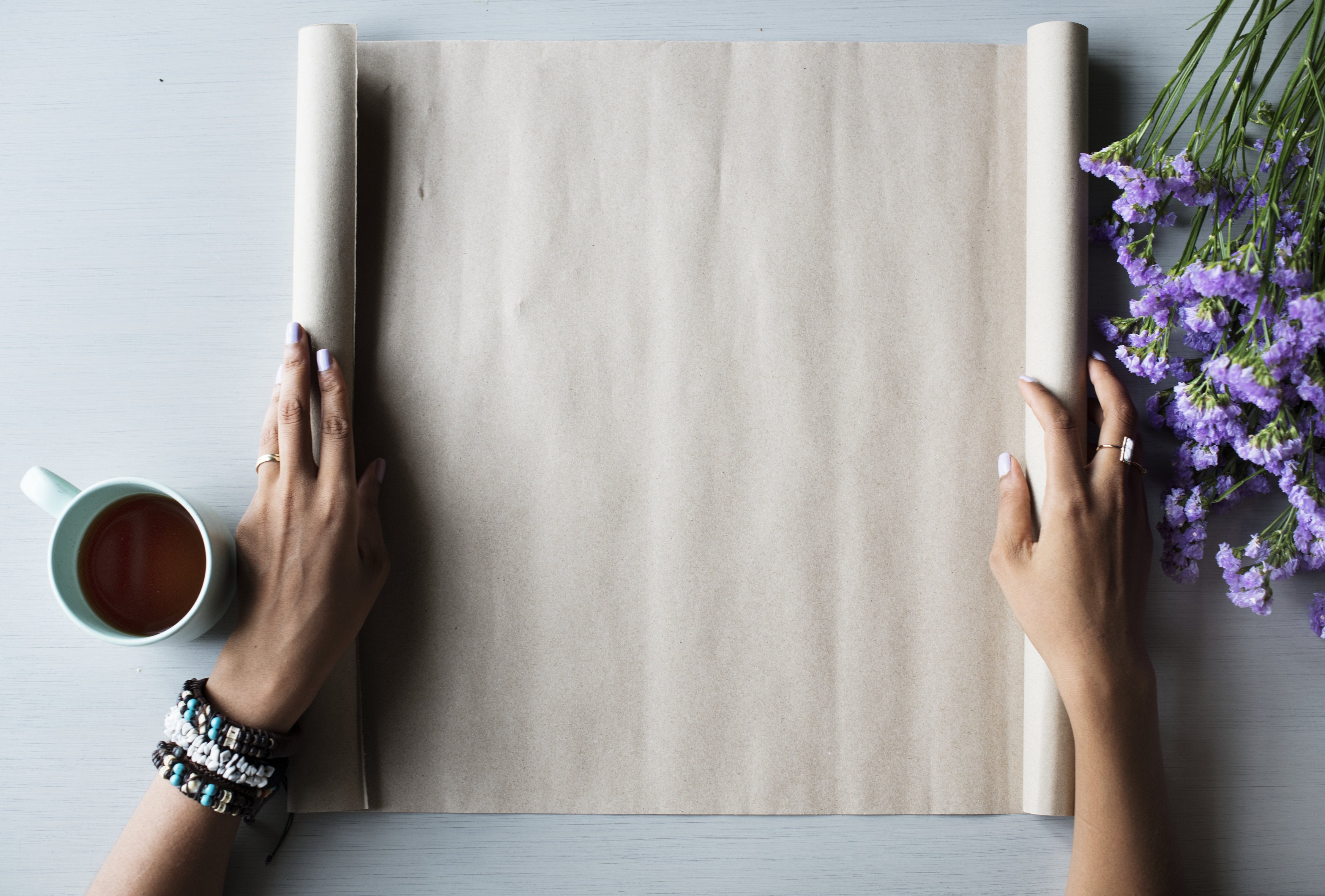 Rolling Out Paper with Purple Flowers