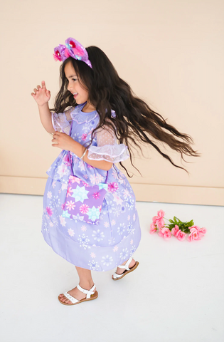 Little girl twirling in flower princess dress