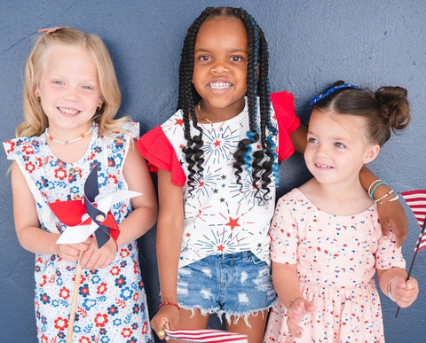 Group of three little girls wearing patriotic clothing