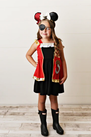 Little girl wearing pirate costume dress