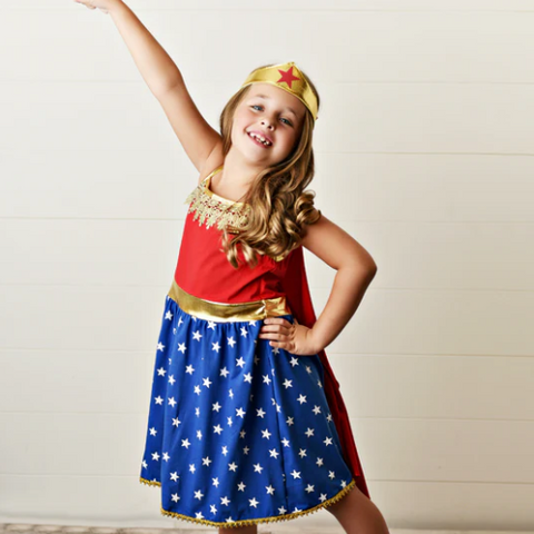 Little girl wearing a super hero costume
