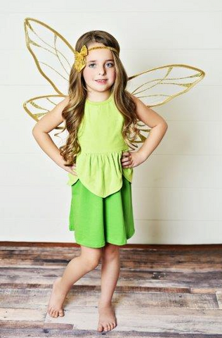 Girl wearing a green fairy costume