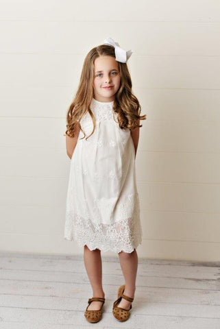 Girl wearing dainty white lace dress