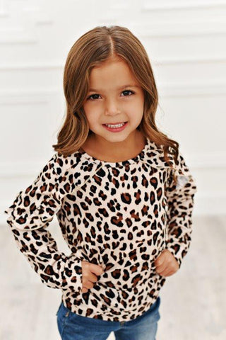 Little girl wearing leopard print ruffle long sleeve
