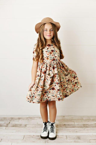 Girl wearing floral twirl dress