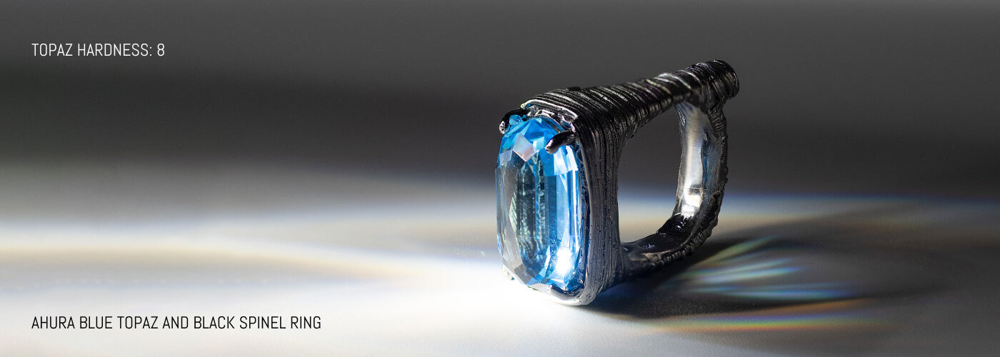 AHURA BLUE TOPAZ AND BLACK SPINEL RING