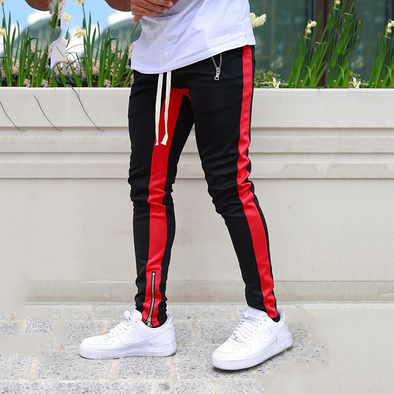 red and black tracksuit bottoms