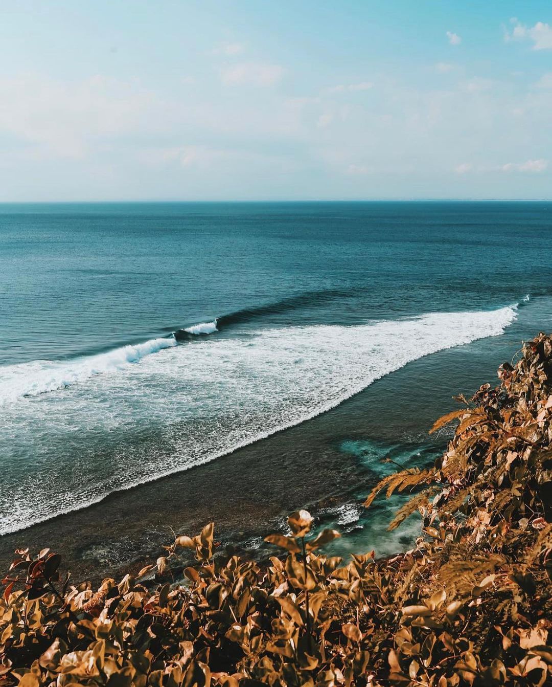 View on a breaking wave in Uluwatu