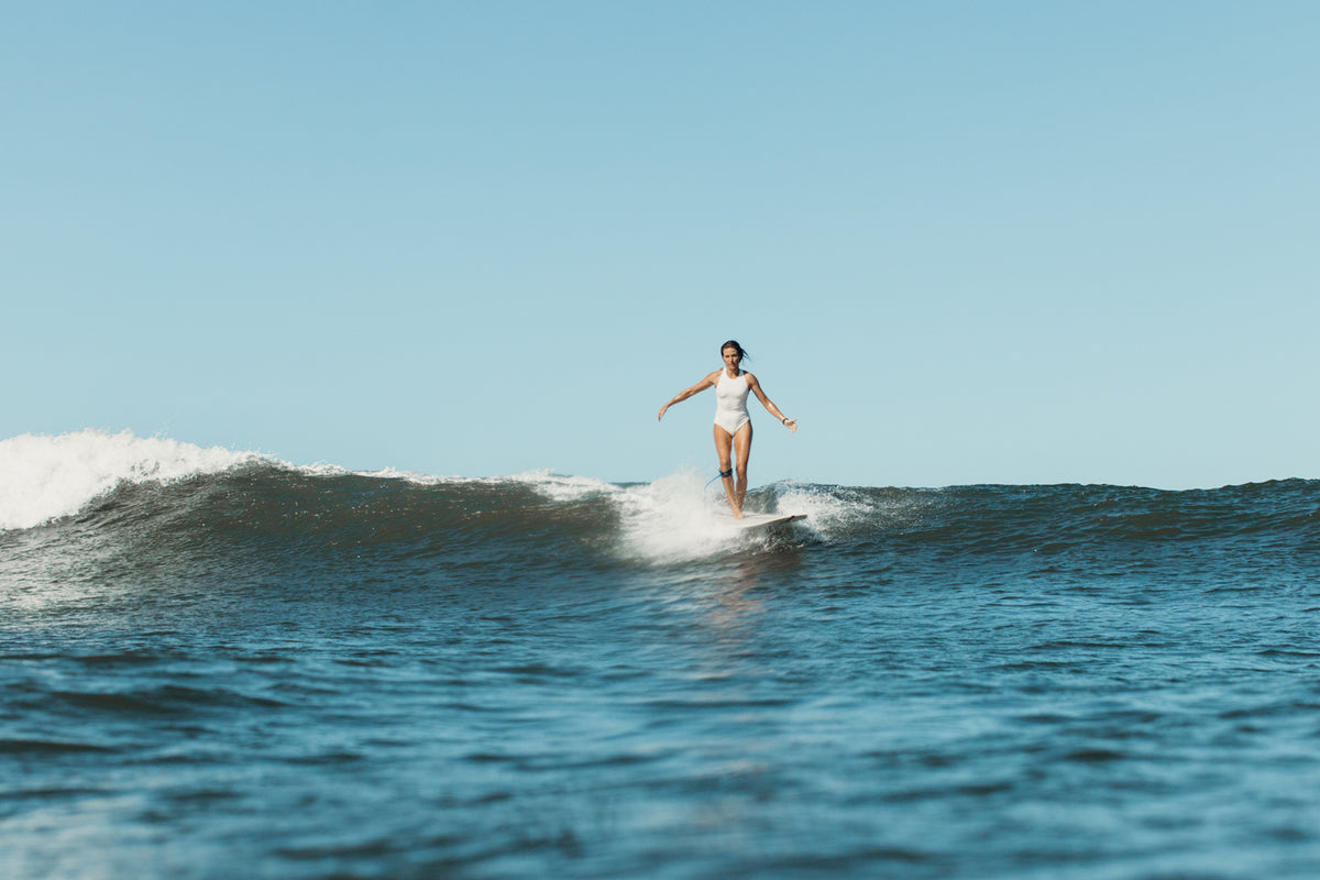 Sustainable surfer girl swimwear review of Anowi Surf. On location in Krui  Sumatra, Indonesia 