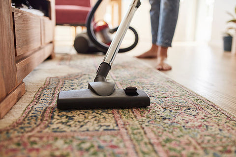 Keeping the house clean by vacuuming