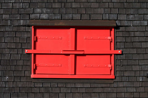 Red shutters on window