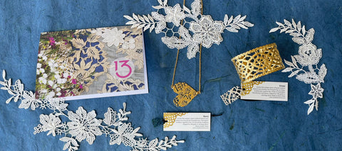 13th anniversary card and 13th anniversary gifts of lace jewelry in 24k gold.