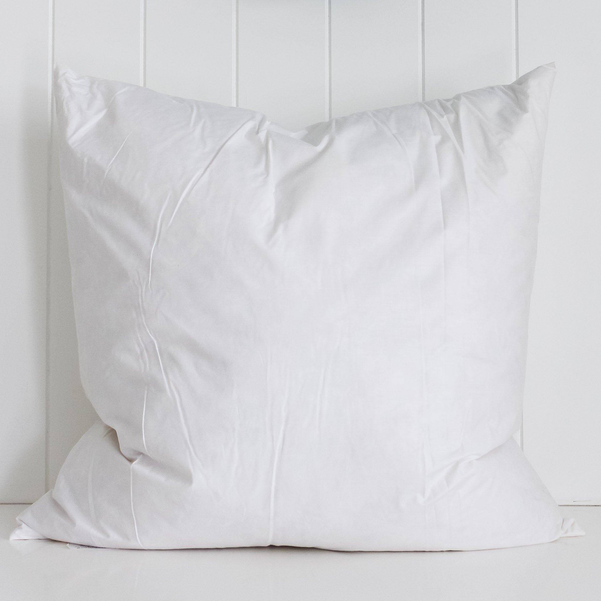 https://cdn.shopify.com/s/files/1/0026/5702/6107/products/feather-filled-cushion-insert-square-55cm-348425.jpg?v=1692919012&width=2048