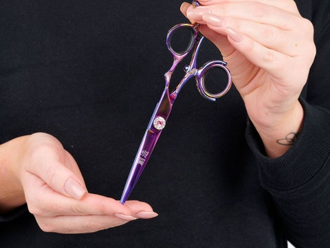 My hair stylist's super fancy scissors have a rotating 3 axis gimbal thumb  ring : r/mildlyinteresting