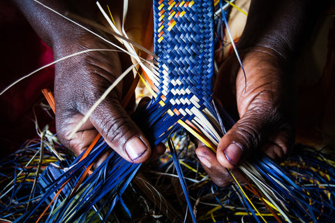 hands crafting raffia