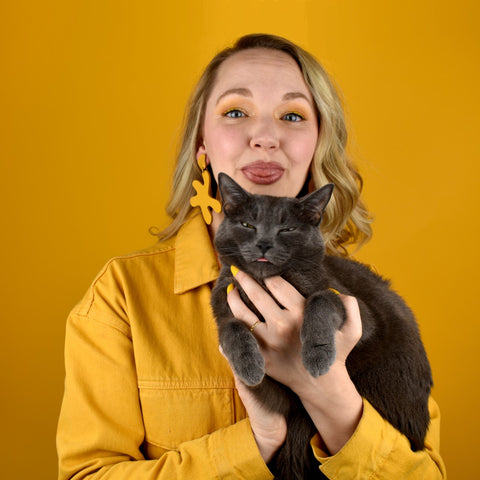 alaina, the designer and maker from cold gold with her kitty