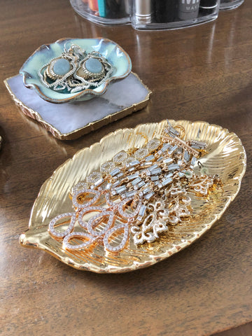 Jewelry in a gold dish decorative