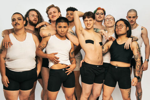 Group of body and race diverse people in Paxsies underwear and binders