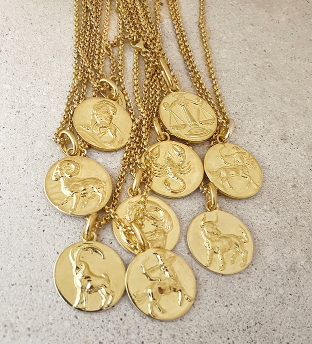 sculpted zodiac sign medallions in gold vermeil
