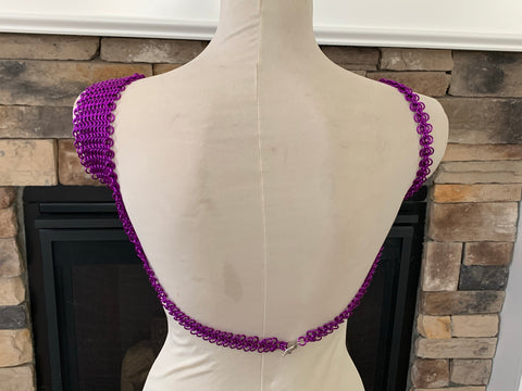 Violet chainmaille dress, back facing, on ivory colored mannequin