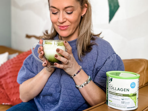 Woman sipping collagen matcha latte