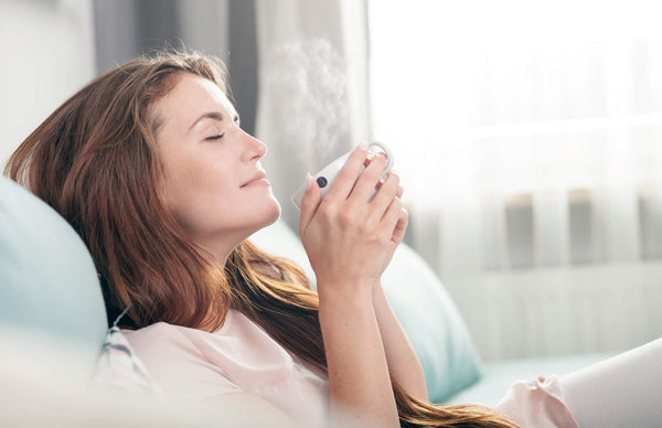 Woman Relaxing with Cup of Tea