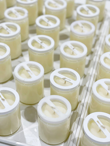 Land of Daughters warehouse making soy coconut candles.
