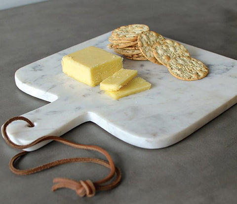 Encourage your kids to help you in the kitchen by chopping vegetables or arranging their own cheese board