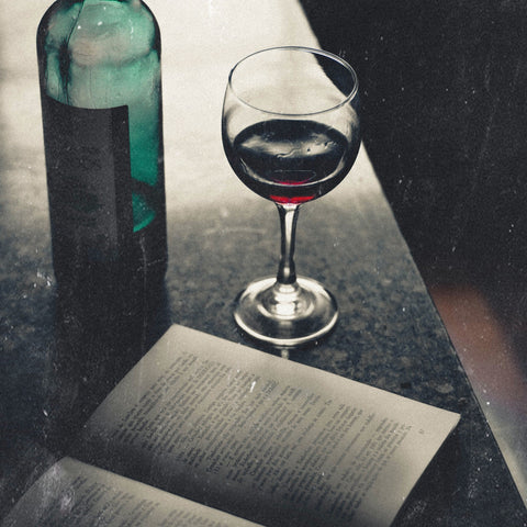 Unwind with a good book and glass of wine - Pexel Image