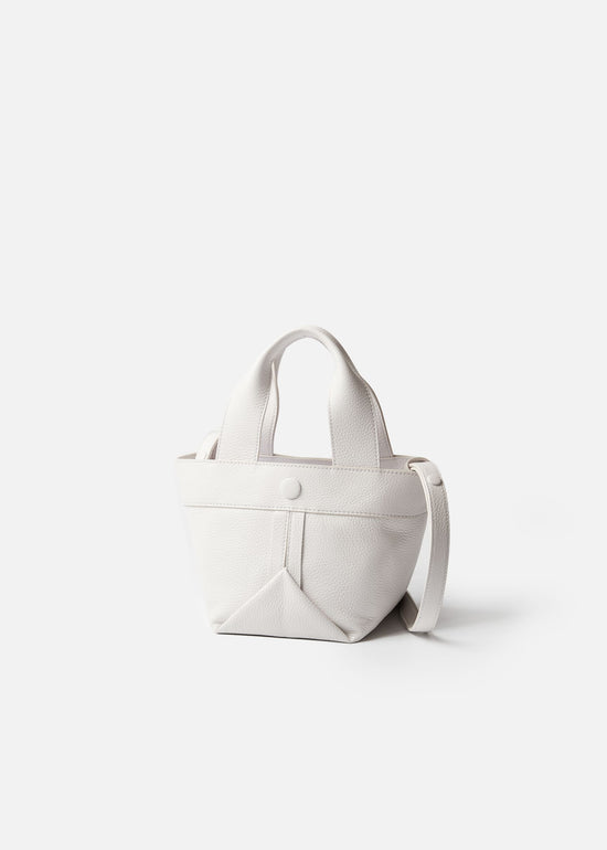 Gusset small pebble leather tote in black with white edge paint