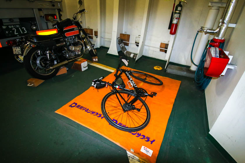 Putting the bike on the ferry.