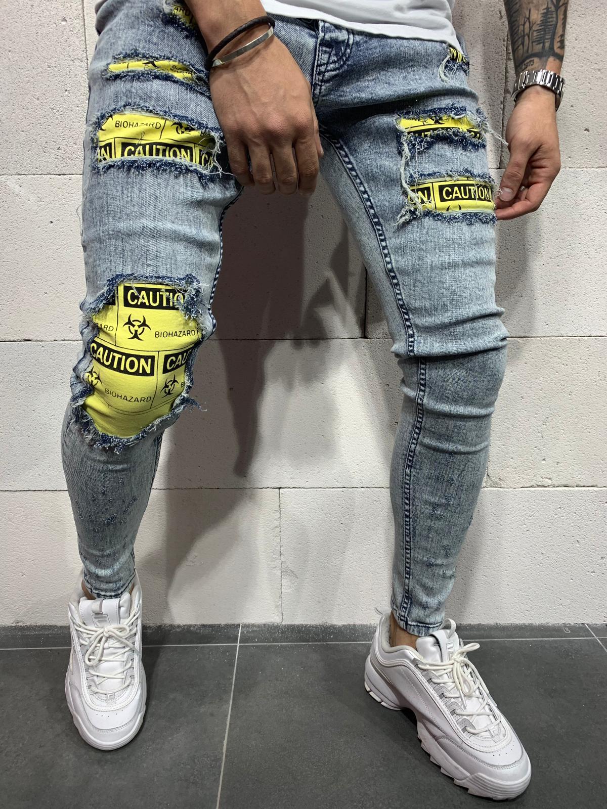 ripped jeans with checkered patches