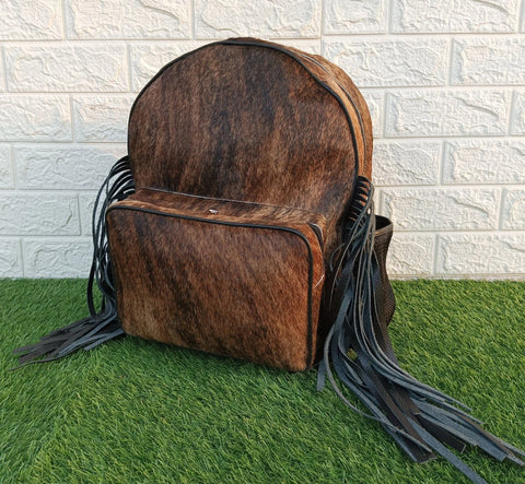 Stand out with our fashionable cowhide backpack and unleash your unique style. Dare to be different and make a statement wherever you go.