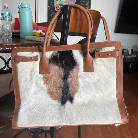 Upgrade your accessory game with our exquisite designer cowhide handbags. Show off your personal style with these chic and timeless pieces.