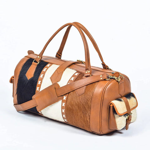 Upgrade your travel style with our ultimate guide to choosing and using the perfect cowhide duffle bag. Travel in luxury and sophistication.