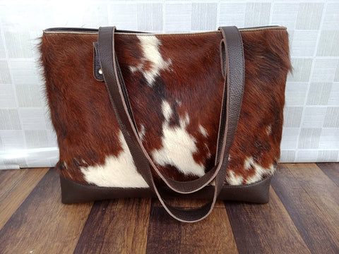 Cowhide purses in brown white