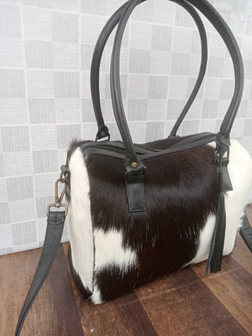 black white cowhide duffle bags