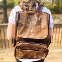 I love this cowhide diaper backpack the leather handles and the interior pocket. There are less attractive cowhide bags out there for triple the price so I'm thrilled with this purchase!