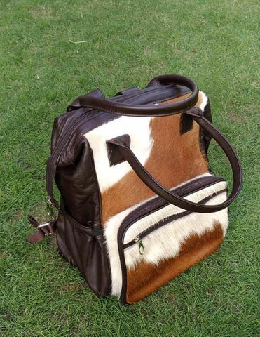 Unleash your individuality with our stylish cowhide backpack - dare to be different and showcase your personal style effortlessly.