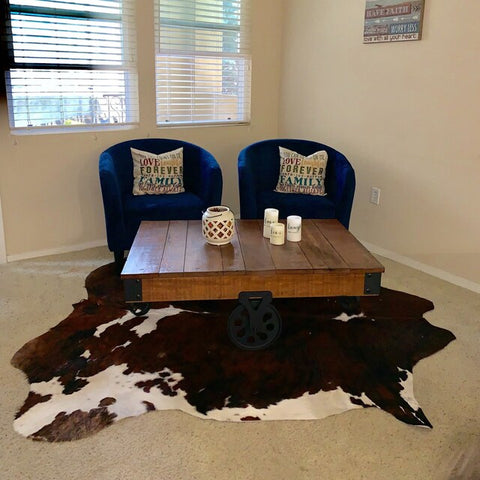 Redefine rustic charm with a sleek geometric cowhide rug. Sharp lines and bold patterns breathe contemporary life into this natural material, ideal for the modern living space.