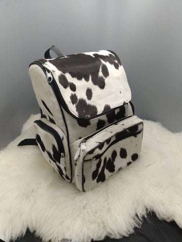 Stand out from the crowd with our stylish cowhide backpack - dare to be different and make a statement wherever you go. Shop now!
