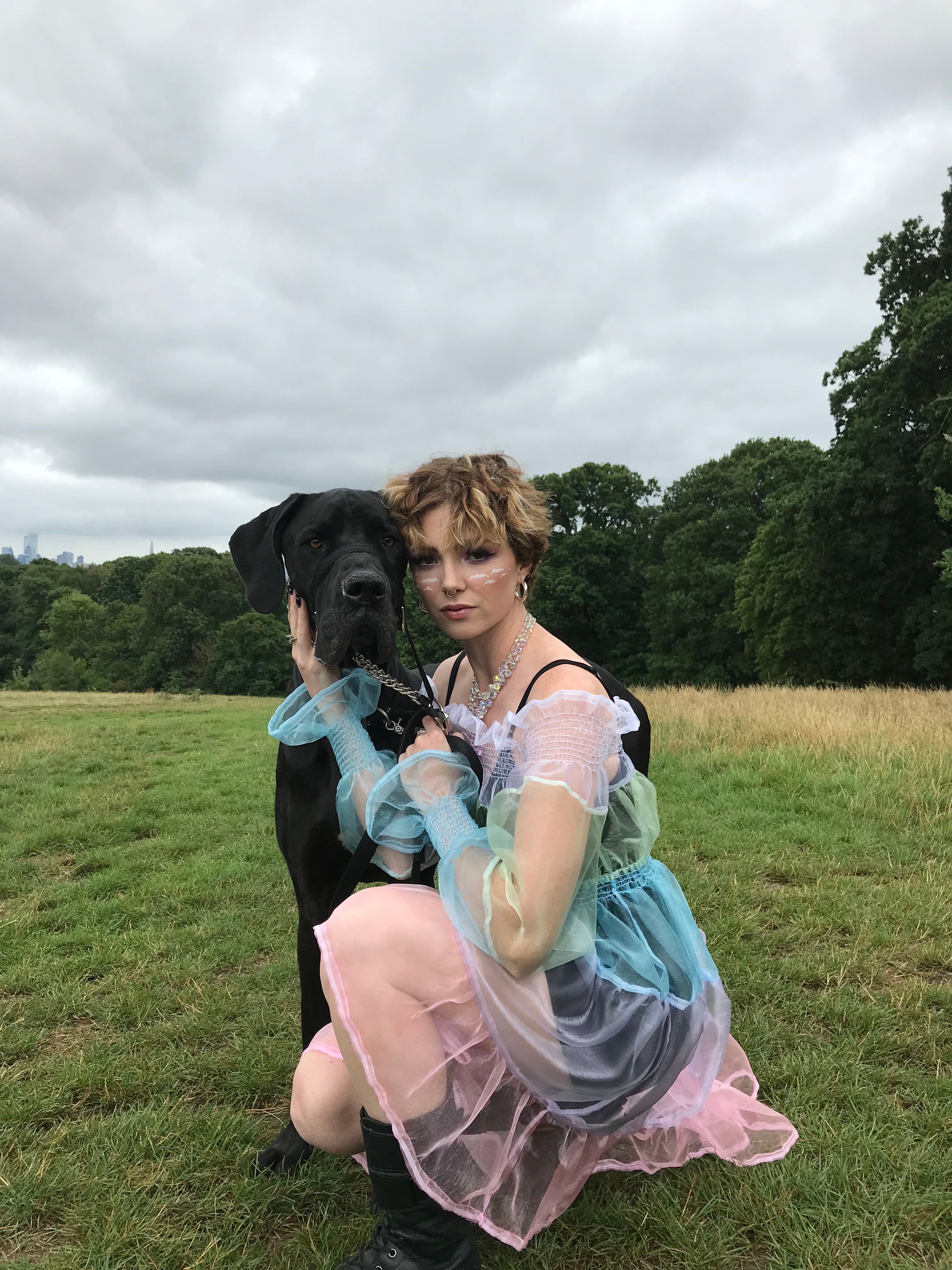 Sarah kneeling, wearing the pastel organza bardot dress