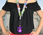 Load image into Gallery viewer, Girl using Figment Magic Band Buddy on a pin trading lanyard
