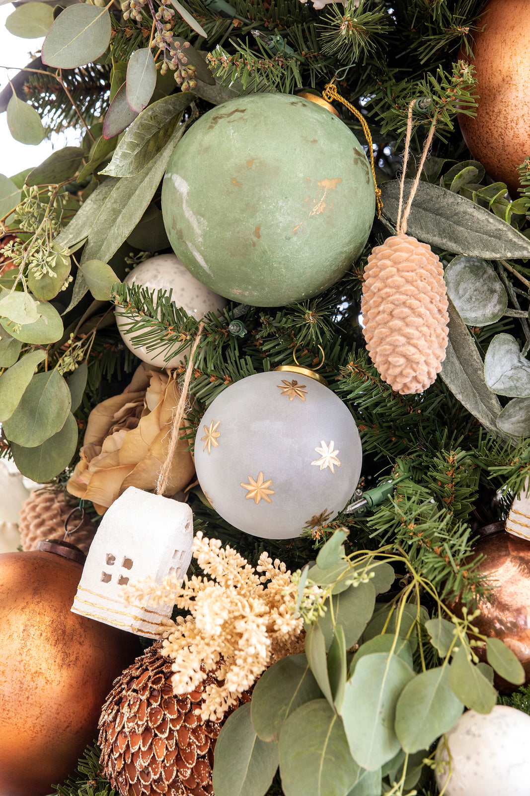 Bria Hammel Christmas tree with white mercury glass ornaments, eucalyptus, and gold balls - Brooke & Lou. #christmasornaments #mercuryglass