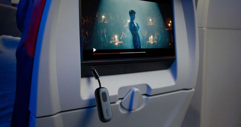 twelve south airfly pro black plugged into an airplane entertainment system