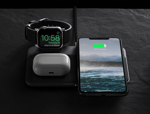 iphone, airpods pro and apple watch charging on a nomad base station