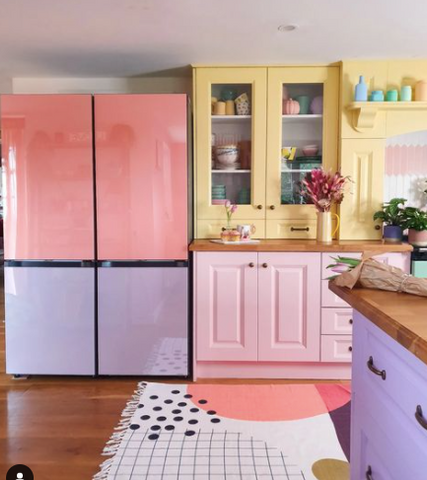 image of colorful kitchen with pink, yellow and purple cabinets 