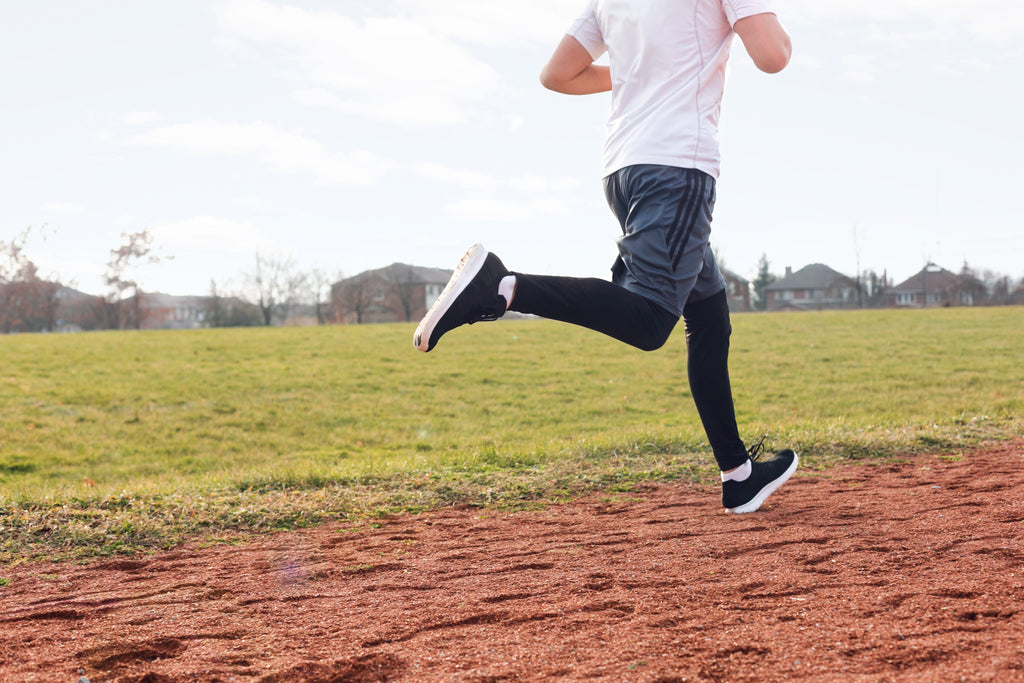 a man running on a dirt road