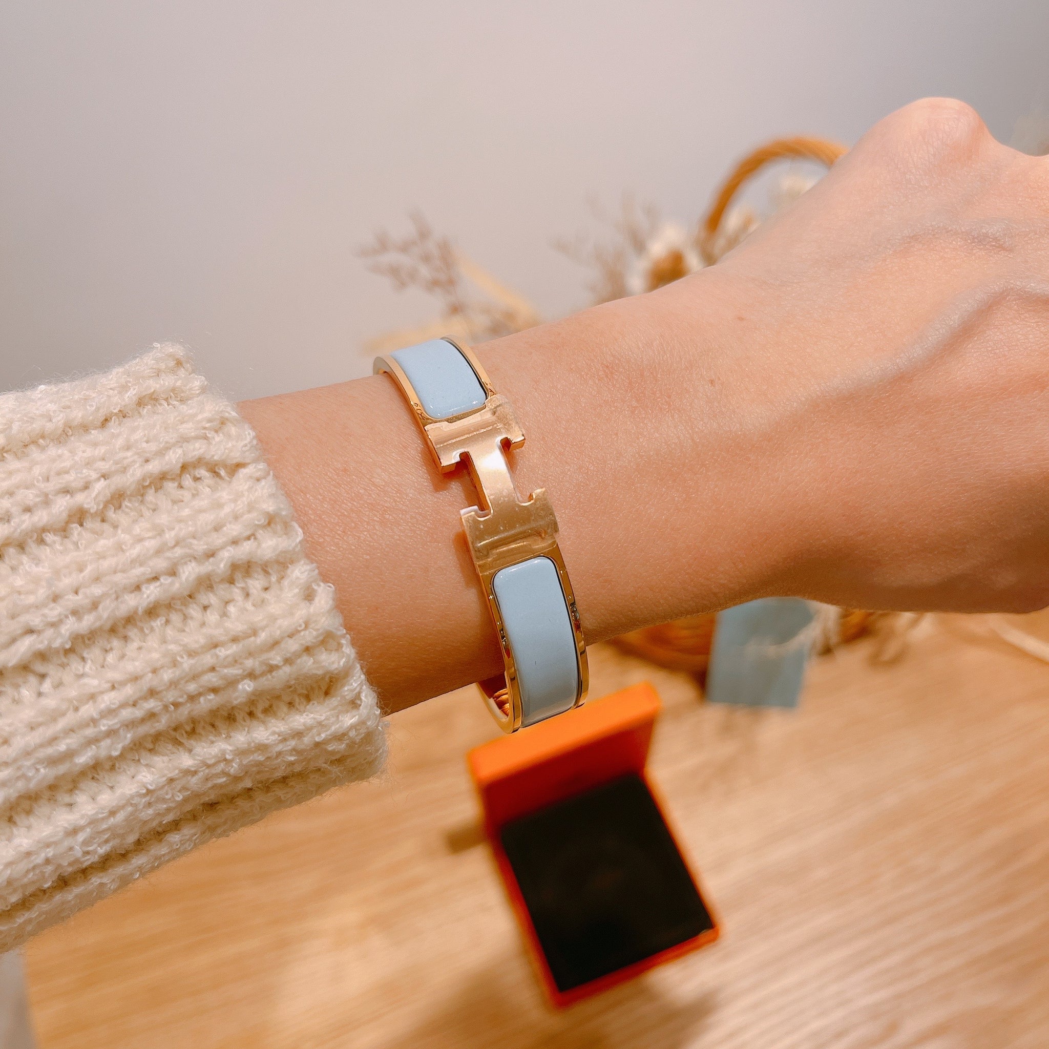 blue and gold hermes bracelet