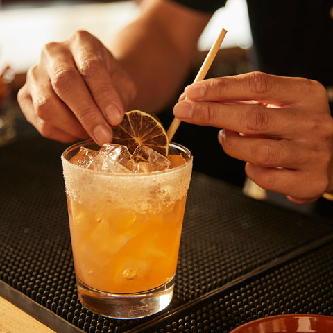Eco Straws Being Placed in Cocktail